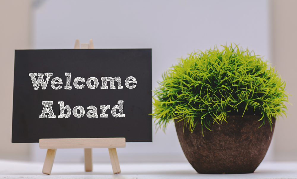 Welcome aboard written on a black board