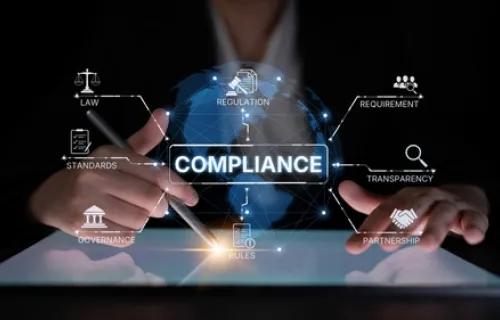 Digital image of a man behind a screen that reads compliance