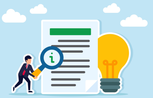 A man holding a magnifying glass against a paper with a light bulb next to it.