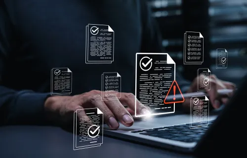 Decorative image with multiple documents surrounding laptop